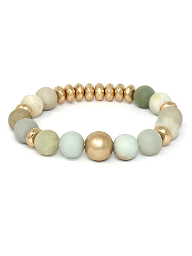 A Blonde and Her Bag Green, blue, and gold multi ball soap stone stretch bracelet.